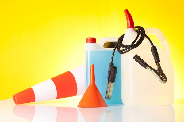 Windshield washer fluids and jump start cables — Stock Photo, Image