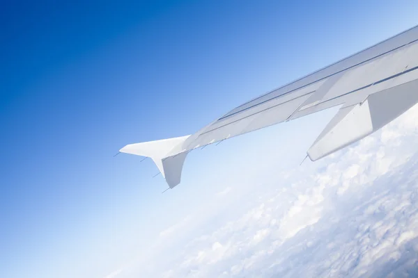 Wings of airplane een through window — Stock Photo, Image