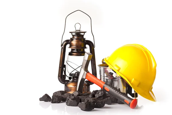 Mining tools with protective helmet, ear muffs,pickaxe and oil lantern — Stock Photo, Image