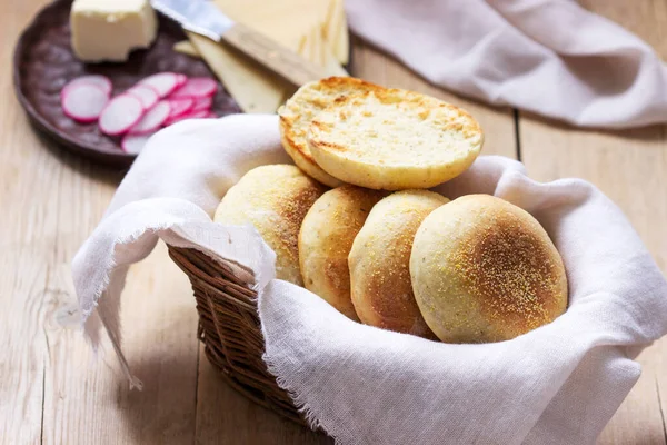 English muffins from whole grain and flax meal, filed with cheese and radish. Rustic style.