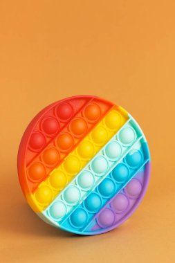 Popular toy pop it antistress rainbow colors, made of silicone. clipart