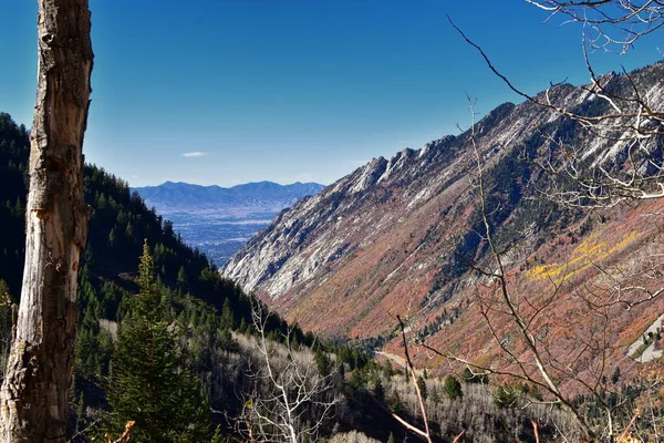 Red Pine Lake views from trail mountain landscape towards Salt Lake Valley in Little Cottonwood Canyon, Wasatch Rocky mountain Range, Utah, United States.