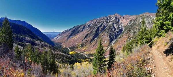 Red Pine Lake views from trail mountain landscape towards Salt Lake Valley in Little Cottonwood Canyon, Wasatch Rocky mountain Range, Utah, United States.