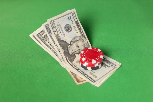 Dollars and poker chips on a green table — Stock Photo, Image