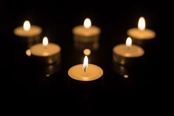 Tea Candles with Reflection on Black — Stock Photo, Image