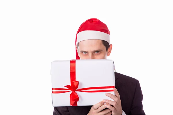 Homem de terno e chapéu com mão presente de Natal no backgro branco — Fotografia de Stock