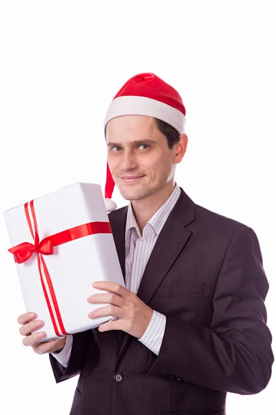 Homem de terno e chapéu com mão presente de Natal no backgro branco — Fotografia de Stock