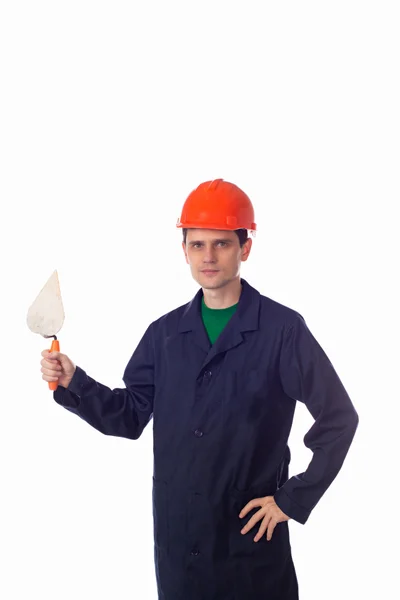 Man in helm en blauw gewaad houden gebouw Troffel — Stockfoto