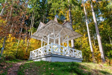 Lookout Karola in Marianske Lazne (Marienbad)  a romantic spot with a bench and scenic views of the spa town, surrounded by forest and peaceful atmosphere.