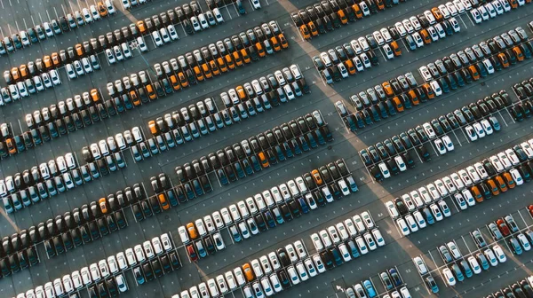 Giant parking of new cars at an automobile factory, aerial view.