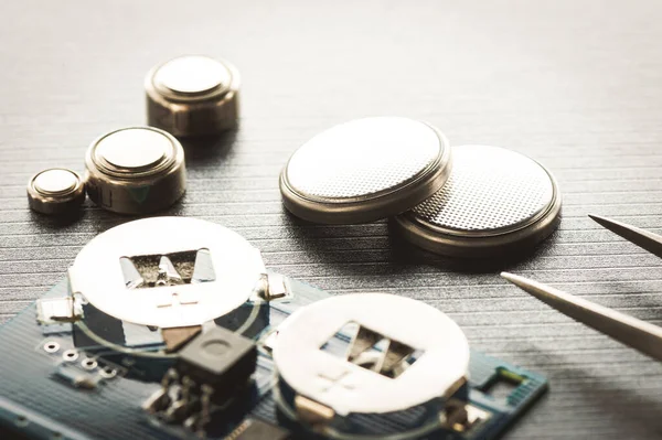 closeup button cell battery or watch battery or coin cell, used to power small electronics devices such as wrist watches or computer motherboard.