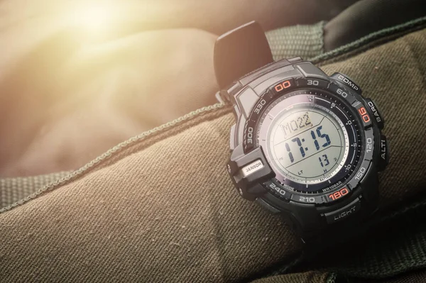 Black digital watch for outdoor activities with stopwatch feature, countdown timer, backlight and water resistance.