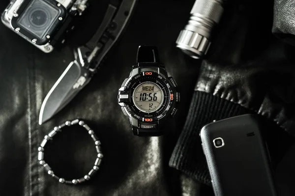 Black digital watch for outdoor activities with stopwatch feature, countdown timer, backlight and water resistance.