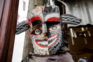 Old Phi Kon Nam mask in Chiang Khan walking street, Loei, Thailand. Phi Kon Nam means something like spirit who carries water or some such (its meant to bring good rains for the growing season).