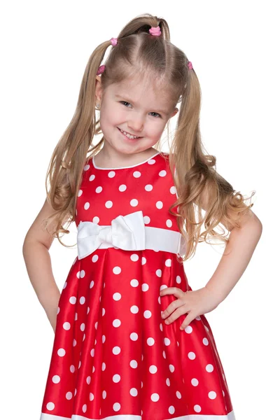 Adorabile bambina in un vestito rosso — Foto Stock