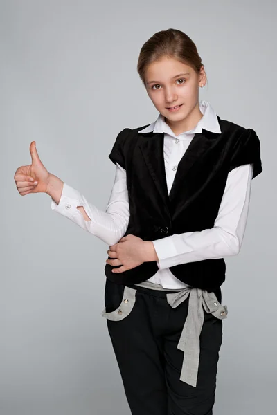 Preteen girl holds his thumbs up — Stock Photo, Image