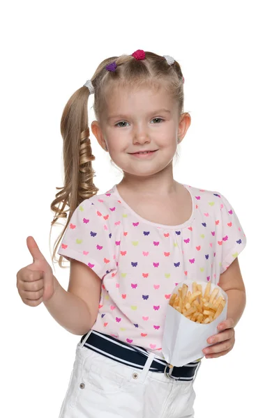 Little girl with fries holds his thumbs up — Stock Photo, Image