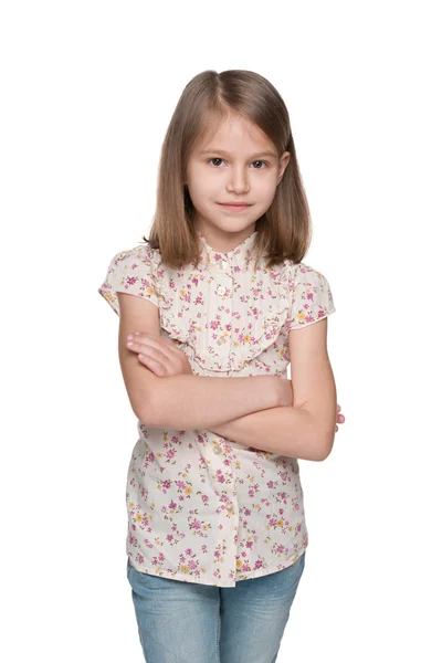 Серйозна маленька дівчинка на білому тлі — стокове фото