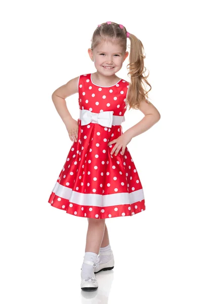 Klein meisje in de polka dot jurk — Stockfoto