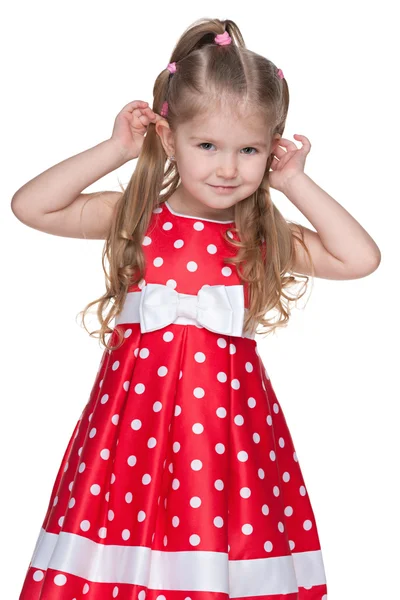 Bedårande liten flicka i prickiga klänning — Stockfoto