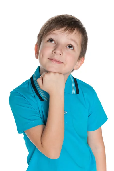 Pequeño niño sonriente pensativo — Foto de Stock