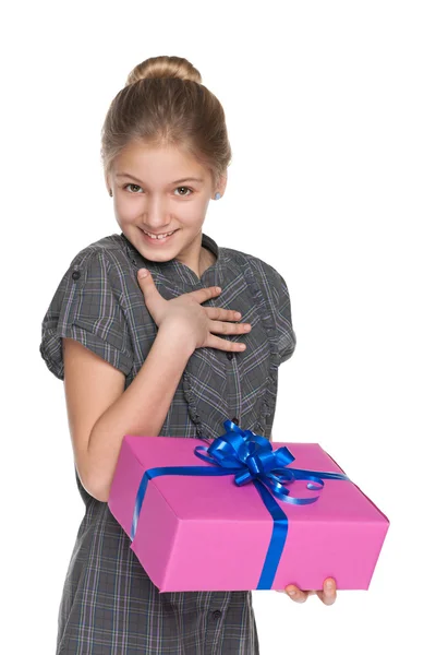 Happy girl holds a gift box — Stock Photo, Image