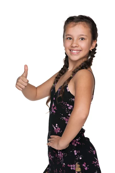 Glad ung flicka håller sin tumme upp — Stockfoto