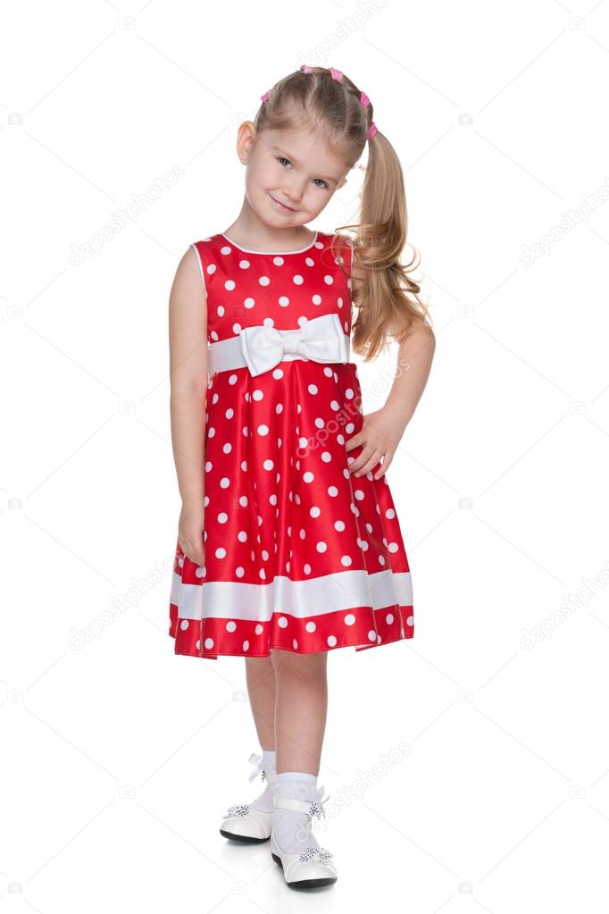 Little girl in the red polka dot dress Stock Photo by ©SergiyN 55491887