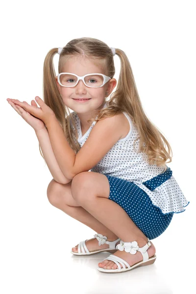 Pretty little girl sits on the floor — Stock Photo, Image