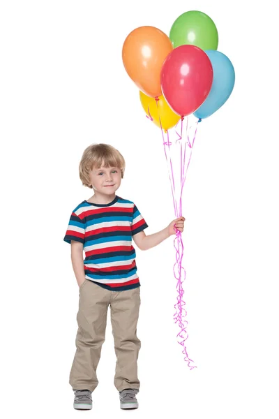 Милый маленький мальчик с воздушными шарами — стоковое фото