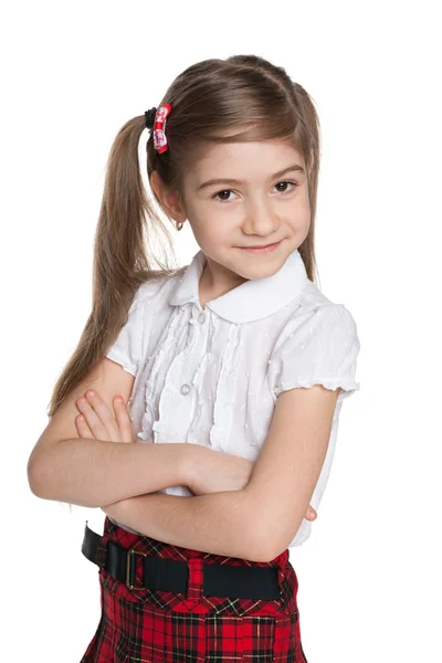Bedårande liten flicka mot vita — Stockfoto