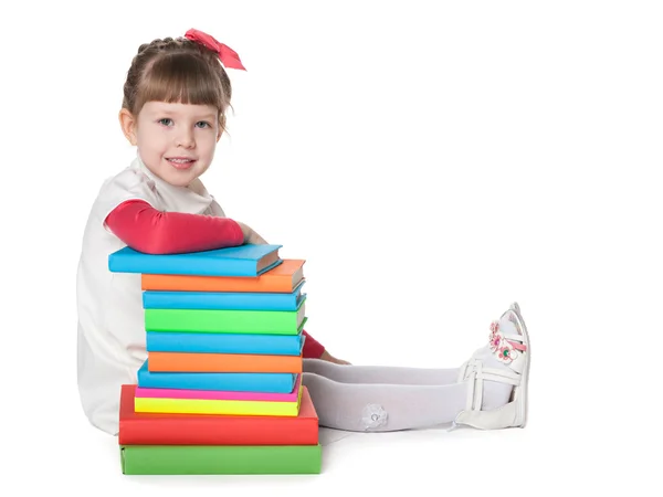 Menina perto de livros — Fotografia de Stock