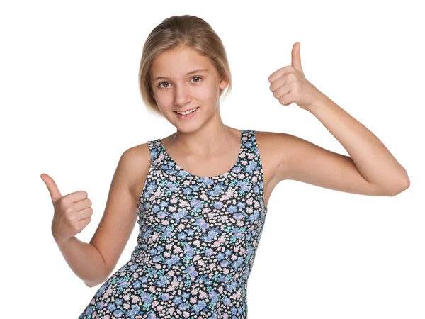 Preteen girl holds her thumbs up — Stock Photo, Image