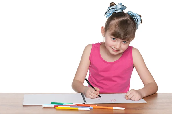 Chica inteligente de la escuela en el escritorio — Foto de Stock