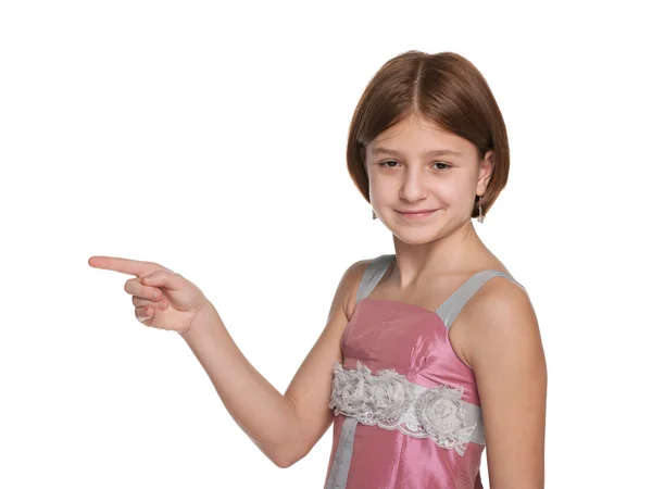 Young girl shows her fingers to the side — Stock Photo, Image