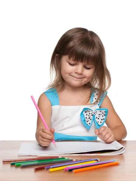 Preschool girl at the desk — Stock Photo, Image