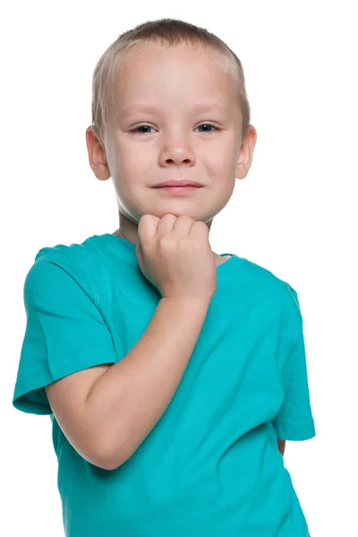 Menino pensativo com uma camisa azul — Fotografia de Stock