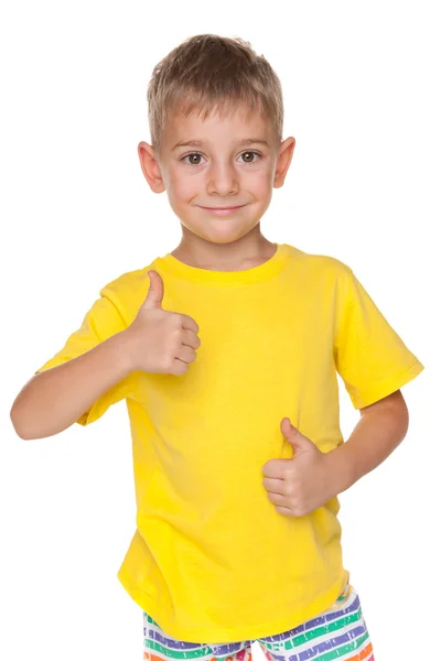 Smiling little boy holds his thumbs up — Stock Photo, Image