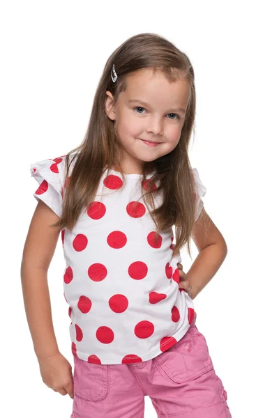 Klein meisje in een polka dot blouse — Stockfoto