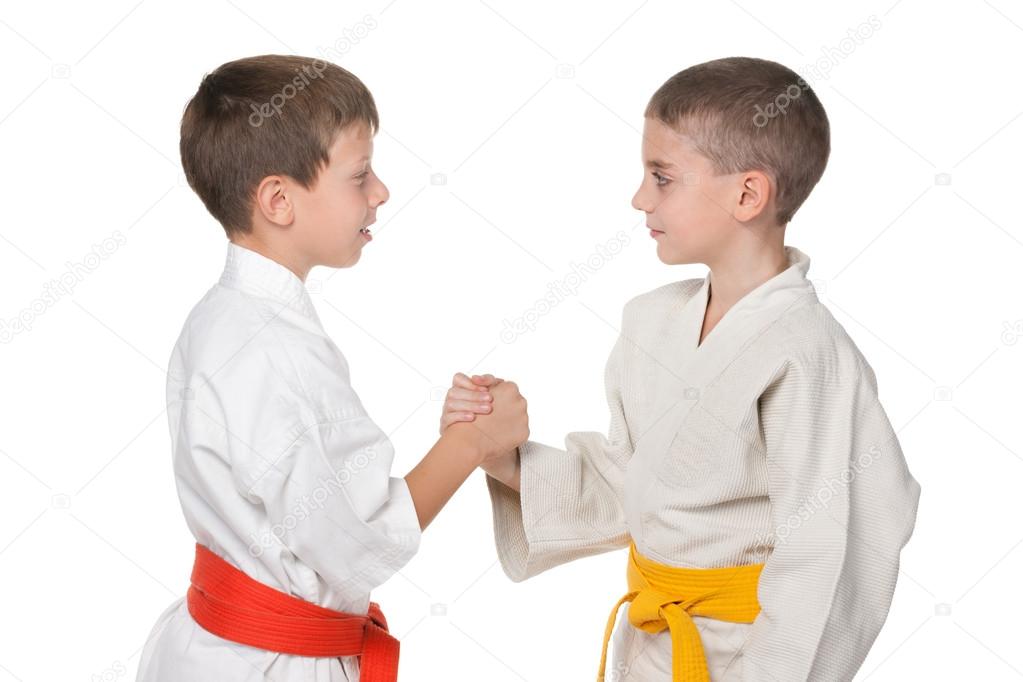 Handshaking of two boys in kimono
