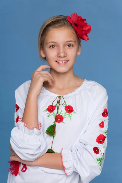 Ukrainian girl against the blue background — Stock Photo, Image