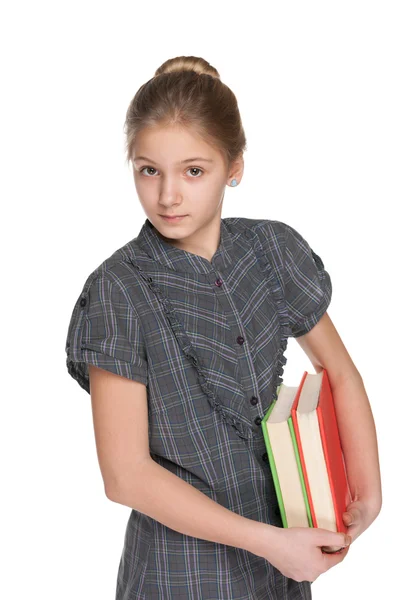 Clever young girl with books — Stock Photo, Image