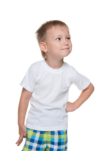Μικρό αγόρι σε ένα λευκό πουκάμισο φαντάζεται — Φωτογραφία Αρχείου