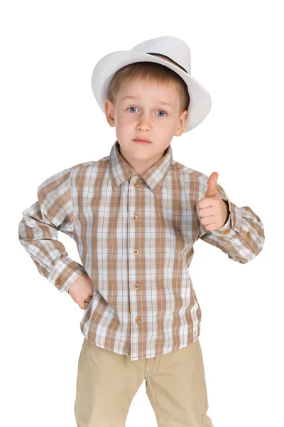 Serious little boy holds his thumb up — Stock Photo, Image