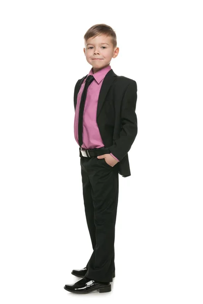 Confident little boy in a black suit — Stock Photo, Image