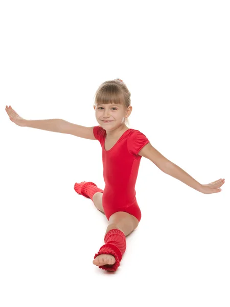 Liten gymnast göra övningar — Stockfoto