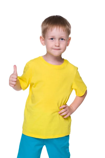 Smiling little boy holds his thumb up — Stock Photo, Image