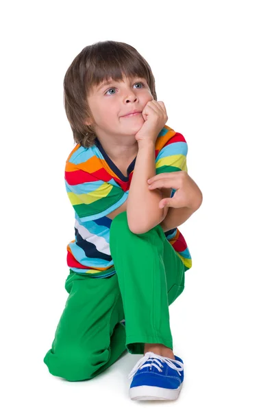 Sorridente giovane ragazzo in pantaloni verdi — Foto Stock