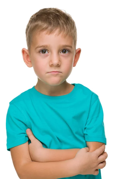 Pensive дошкільний хлопчик проти білого — стокове фото