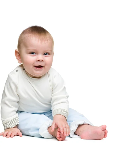 Uśmiechnięty chłopiec dziecko siedzi — Zdjęcie stockowe